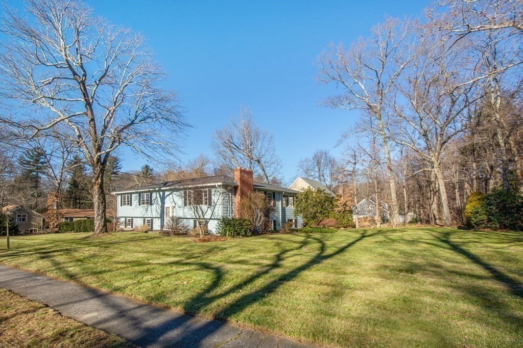 54 Carpenter Road Northbridge, MA 01588 - Photo 3 of 42 a view of a white house with a large tree