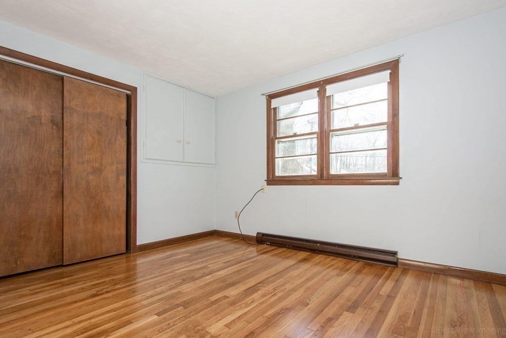 54 Carpenter Road Northbridge, MA 01588 - Photo 31 of 42 an empty room with wooden floor and windows