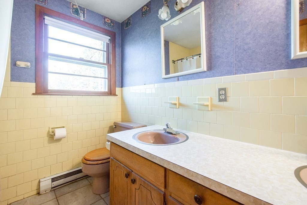 54 Carpenter Road Northbridge, MA 01588 - Photo 33 of 42 a bathroom with a sink a toilet and a window