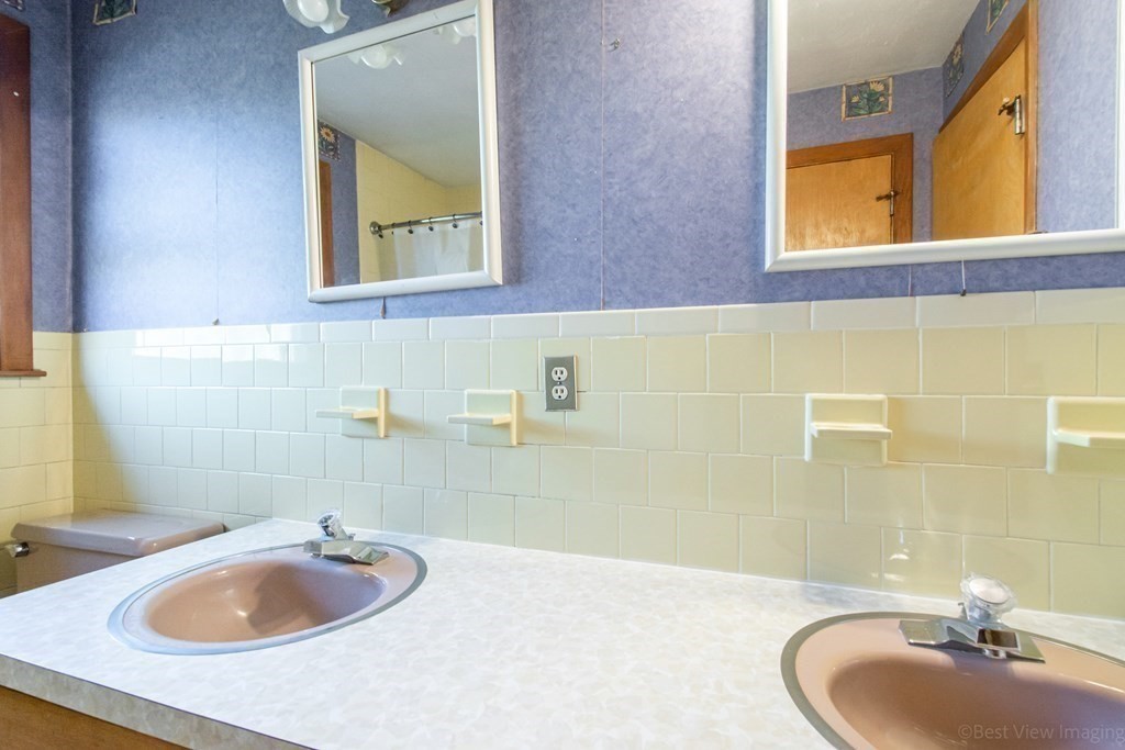 54 Carpenter Road Northbridge, MA 01588 - Photo 34 of 42 a bathroom with a sink and a mirror