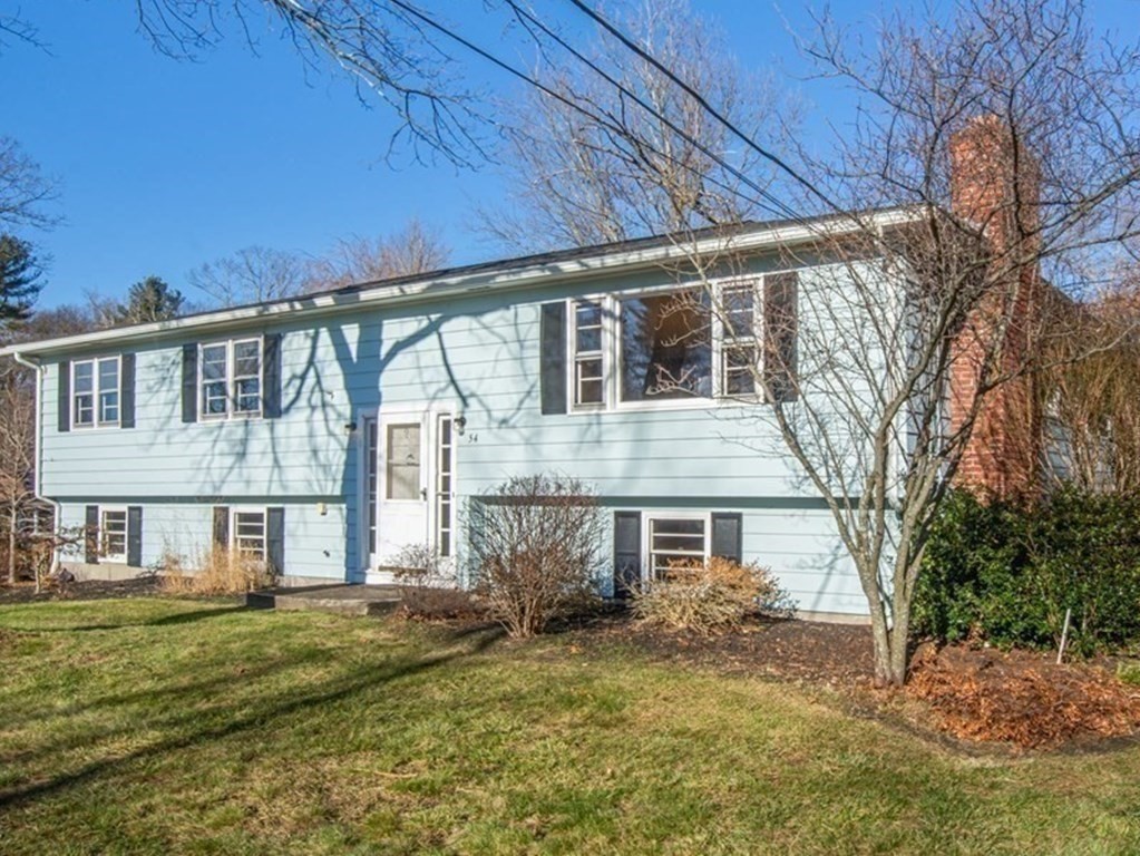 54 Carpenter Road Northbridge, MA 01588 - Photo 4 of 42 a front view of a house with a yard