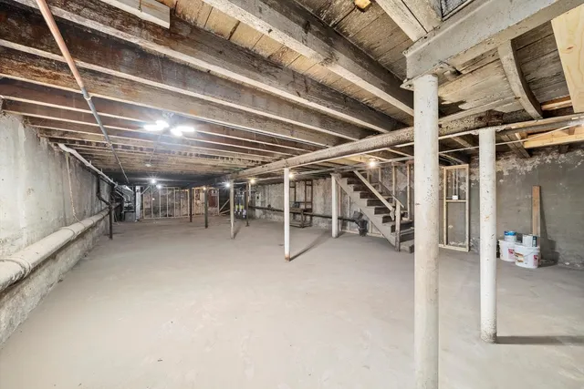 a view of an empty room with wooden roof