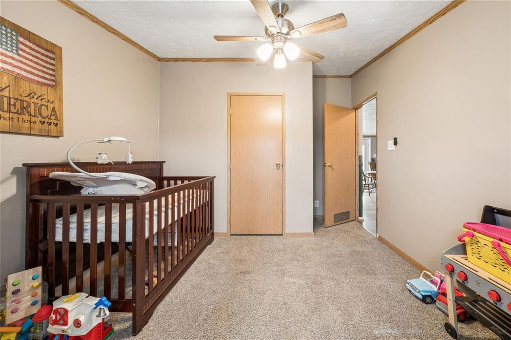 275 Adamik Road Clarksville, PA 15322 - Photo 22 of 39 a view of an empty room with toys and a fan