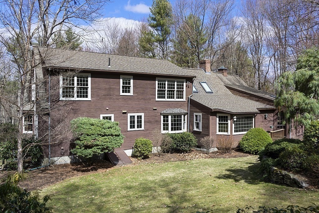 24 Meadow Road Bolton, MA 01740 - Photo 31 of 36 a front view of a house with a yard