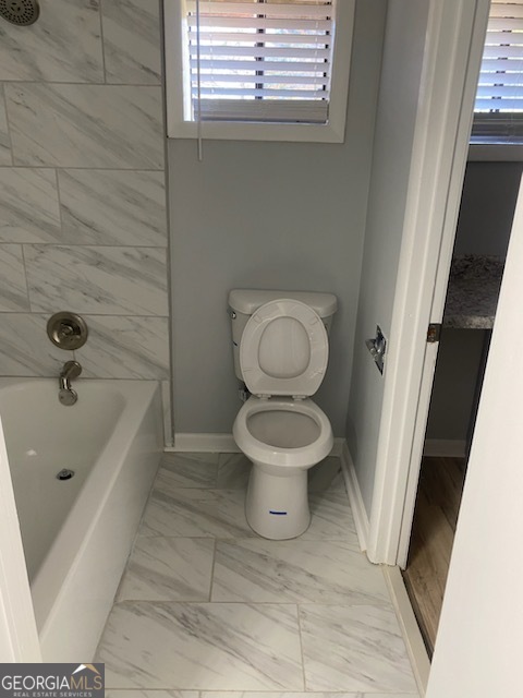 34 Quail Run Decatur, GA 30035 - Photo 13 of 21 a bathroom with a toilet and a bathtub