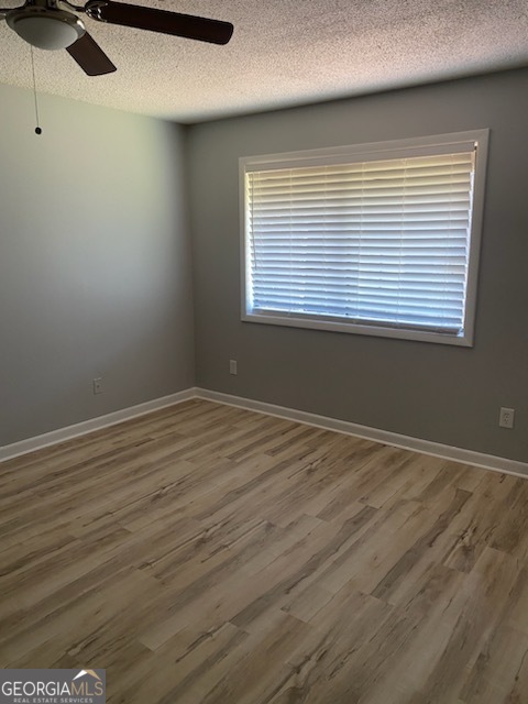 34 Quail Run Decatur, GA 30035 - Photo 16 of 21 wooden floor in an empty room with a window