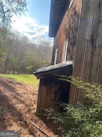 a view of a backyard of the house