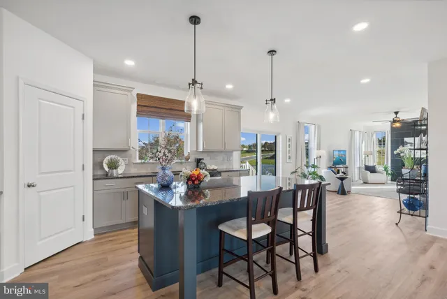a kitchen with counter top space appliances and cabinets