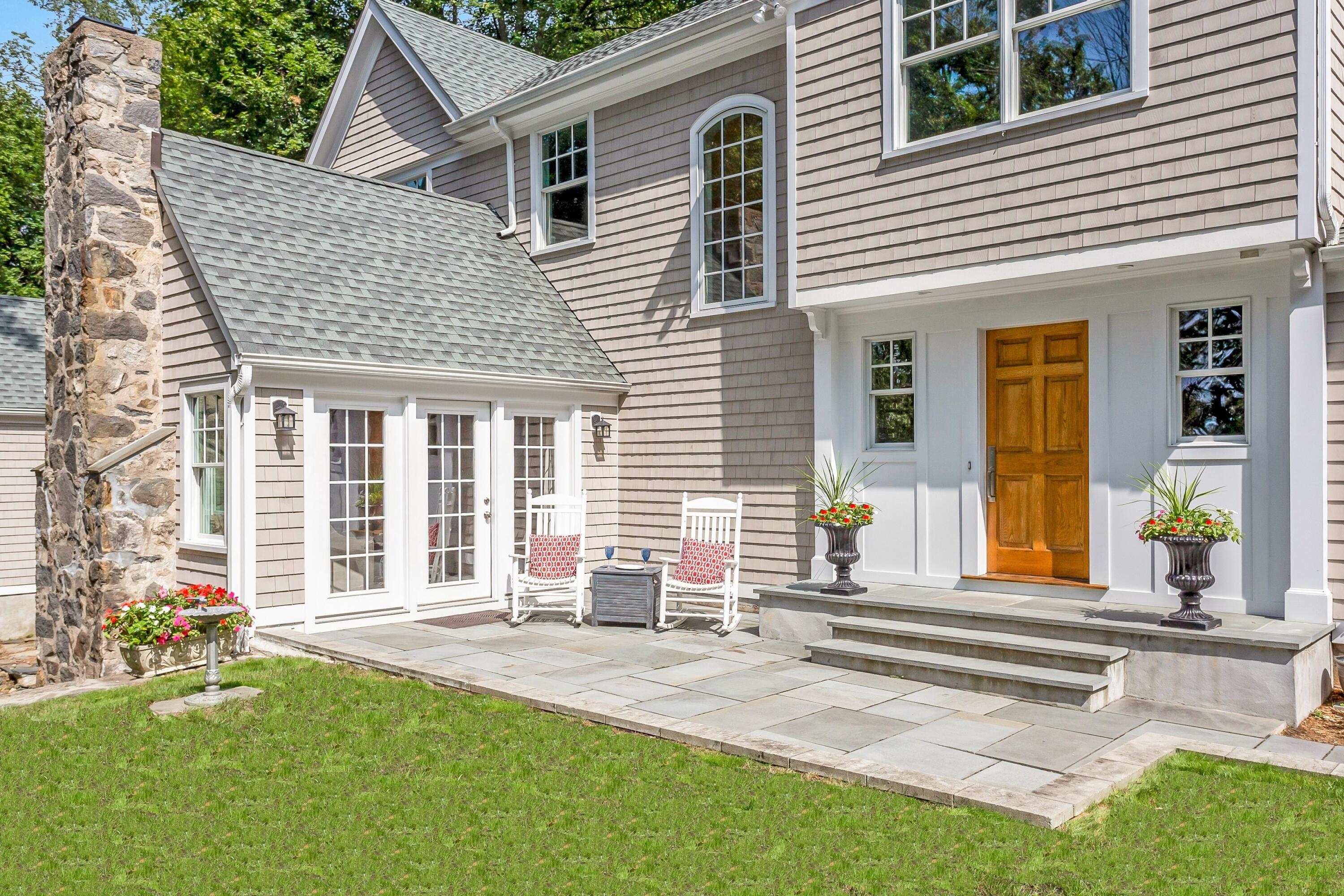 2 Cedar Gate Road Darien, CT 06820 - Photo 2 of 42 a front view of a house with a patio