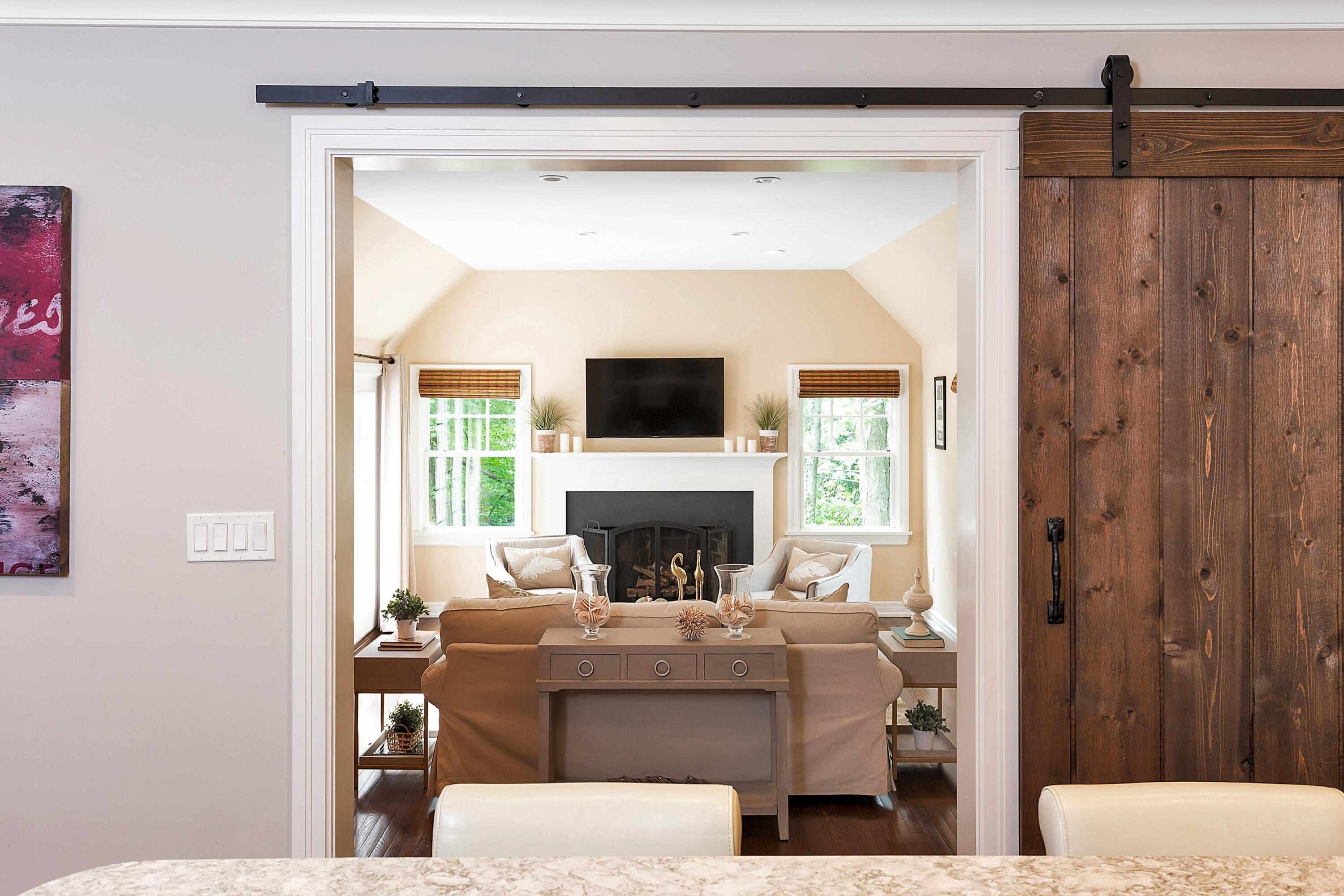 2 Cedar Gate Road Darien, CT 06820 - Photo 13 of 42 a living room with furniture a fireplace and a flat screen tv