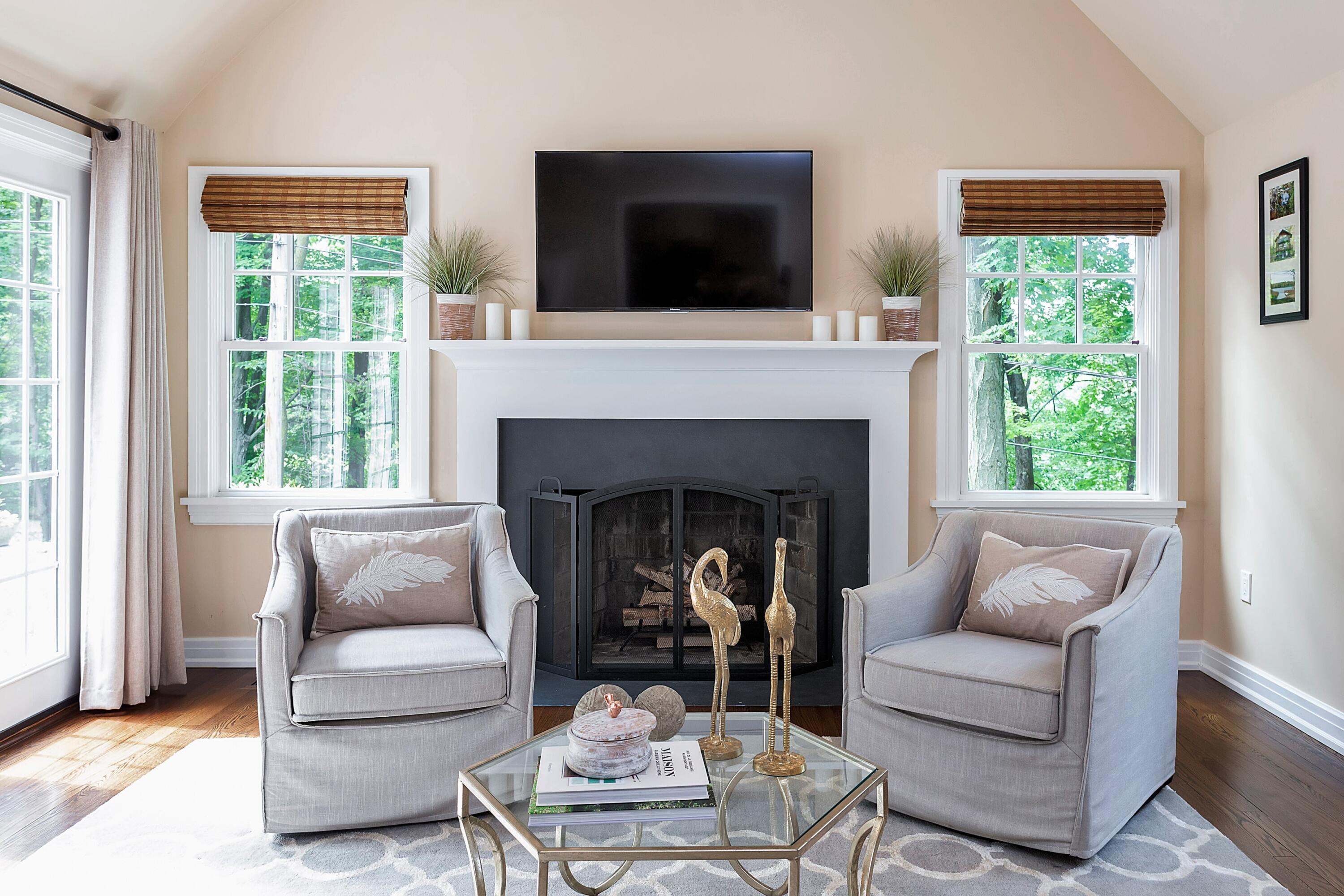 2 Cedar Gate Road Darien, CT 06820 - Photo 16 of 42 a living room with furniture a flat screen tv and a fireplace