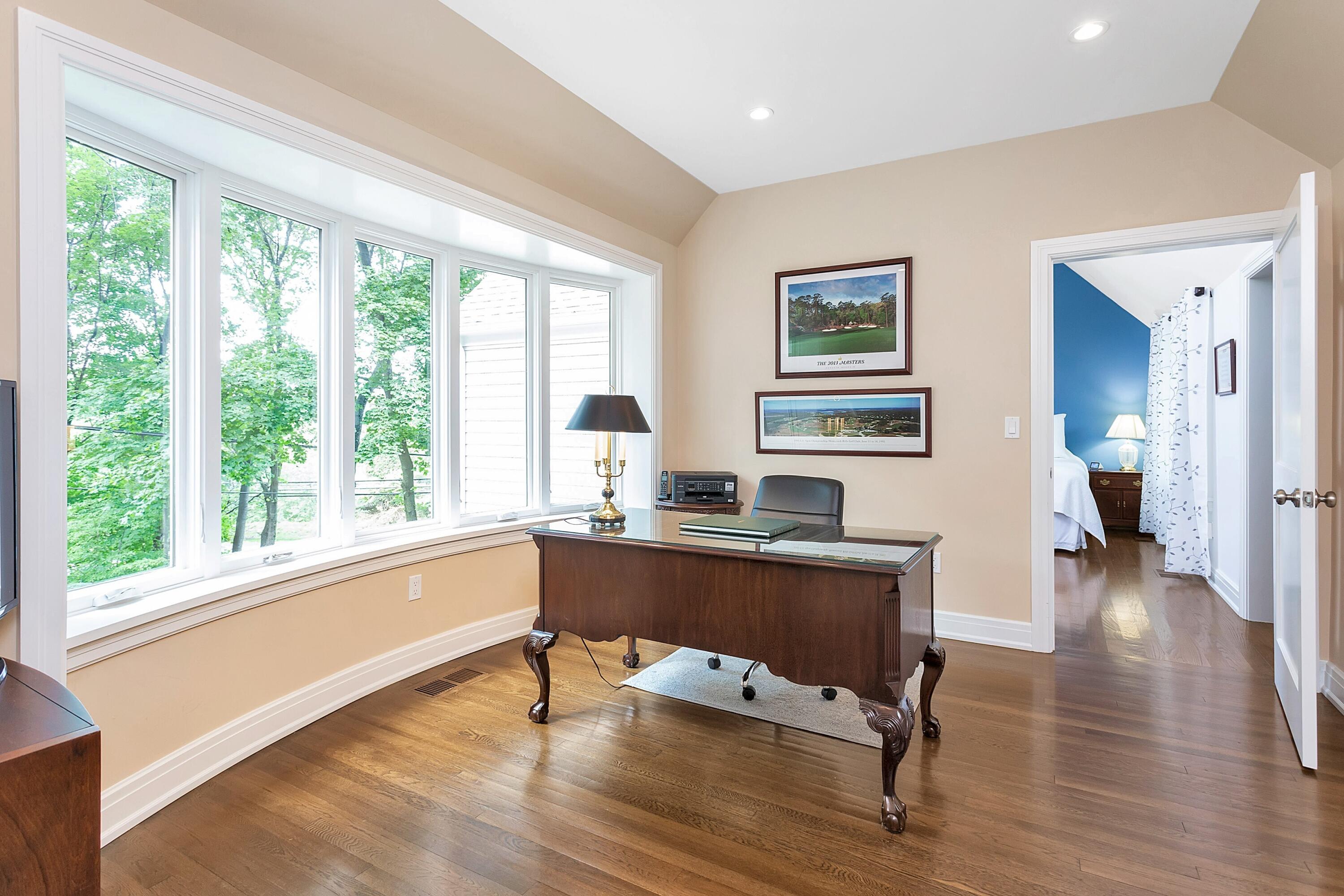 2 Cedar Gate Road Darien, CT 06820 - Photo 18 of 42 a view of a workspace with furniture and a window