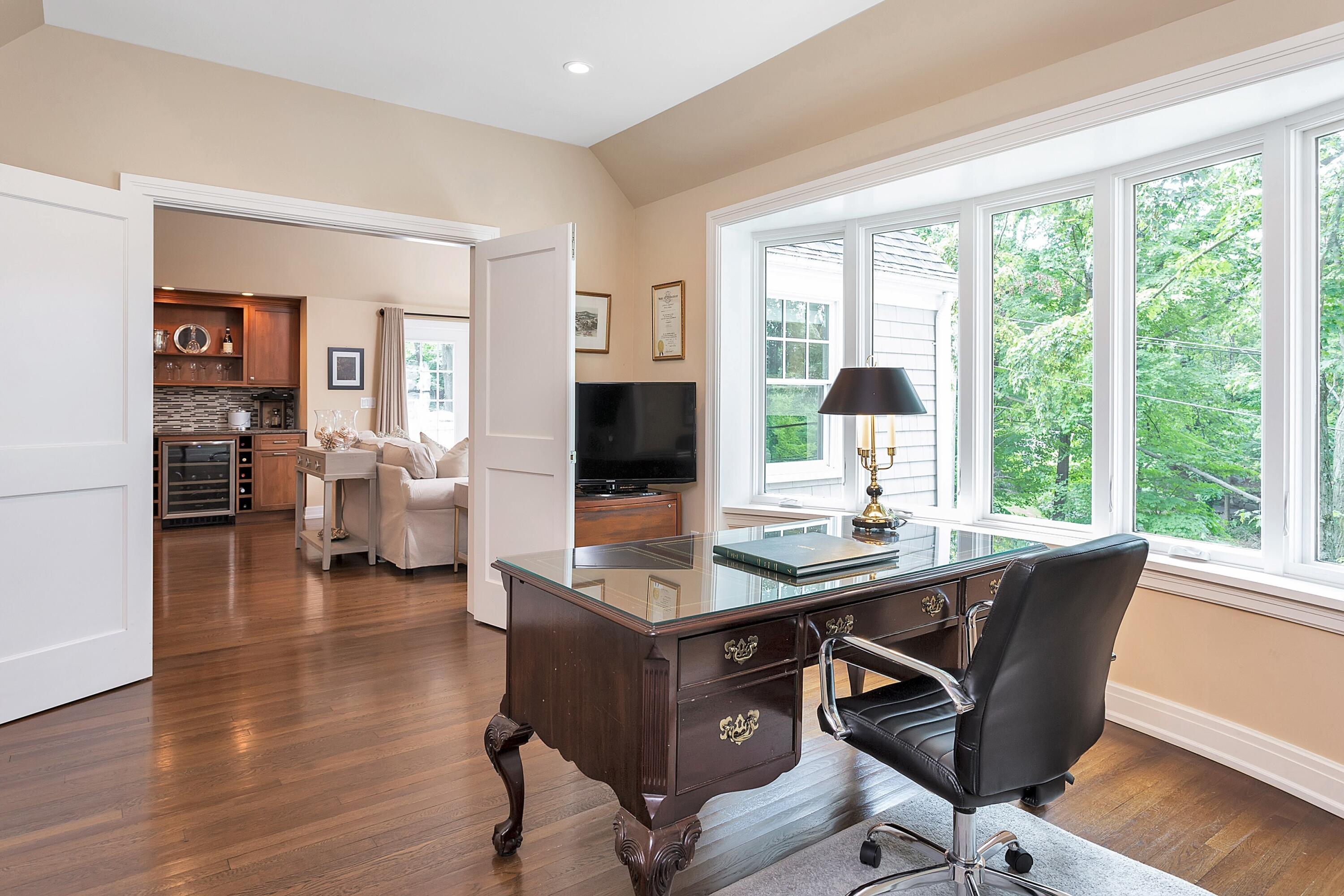 2 Cedar Gate Road Darien, CT 06820 - Photo 19 of 42 a view of a workspace with furniture and a window