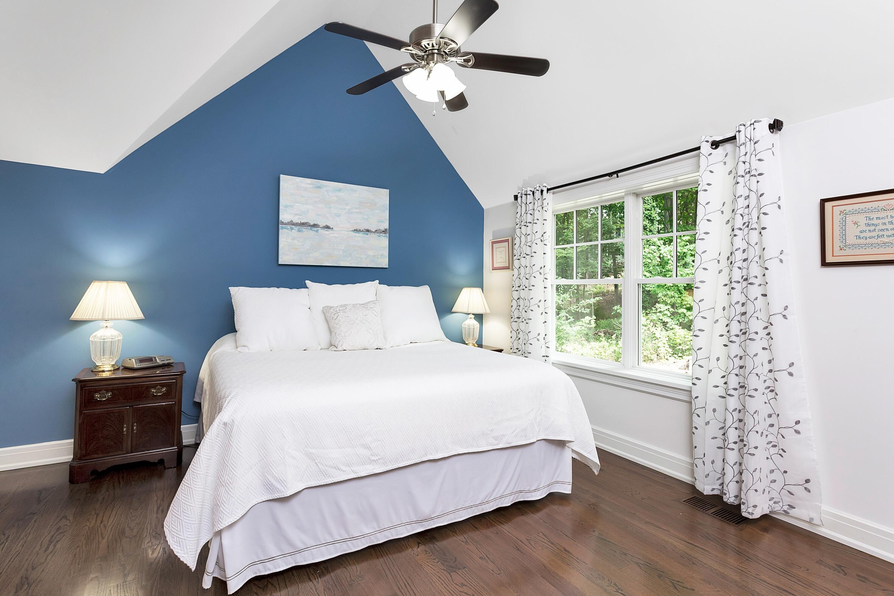 2 Cedar Gate Road Darien, CT 06820 - Photo 20 of 42 a bedroom with a bed and wooden floor