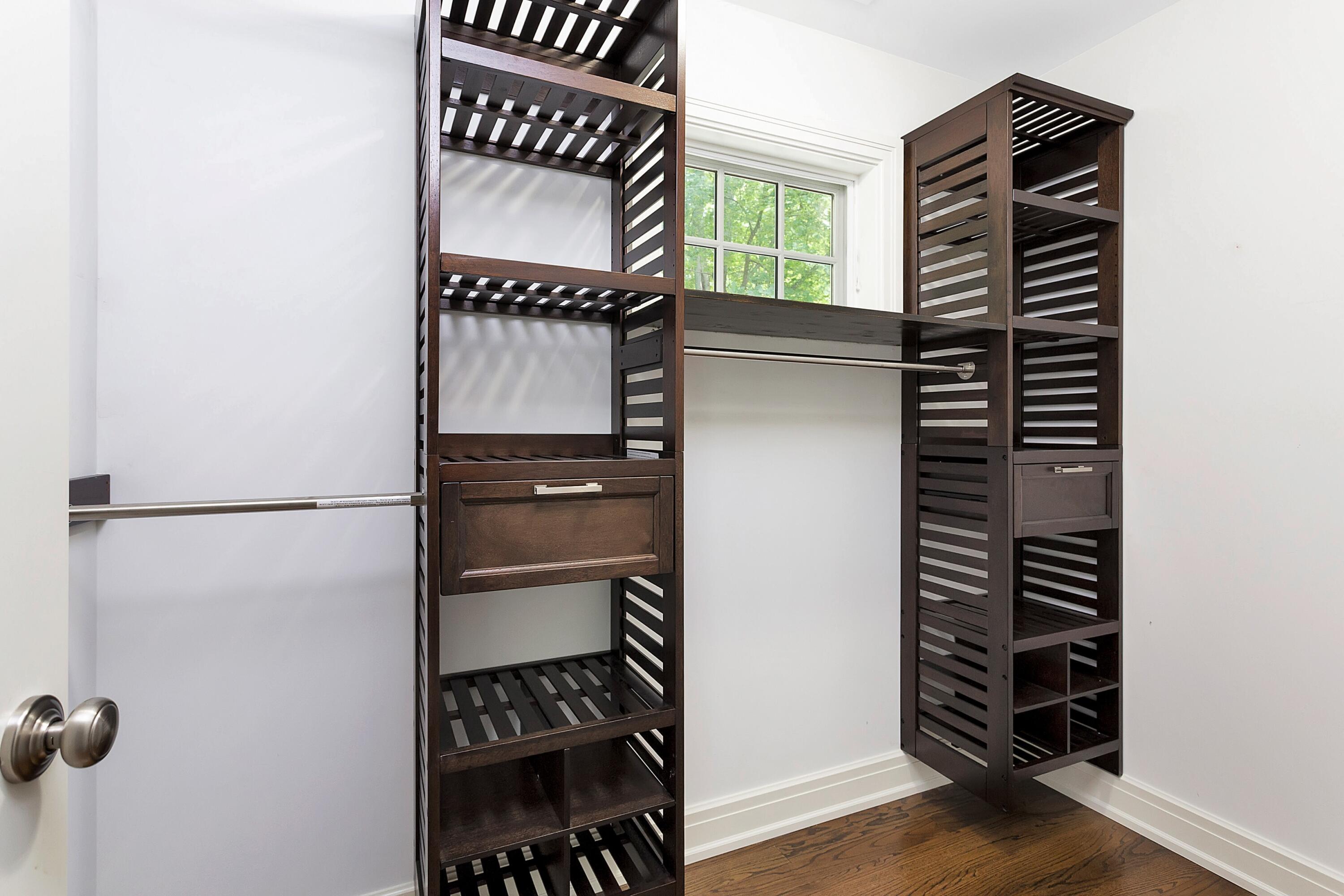 2 Cedar Gate Road Darien, CT 06820 - Photo 28 of 42 a view of walk in closet with clothes and shoes
