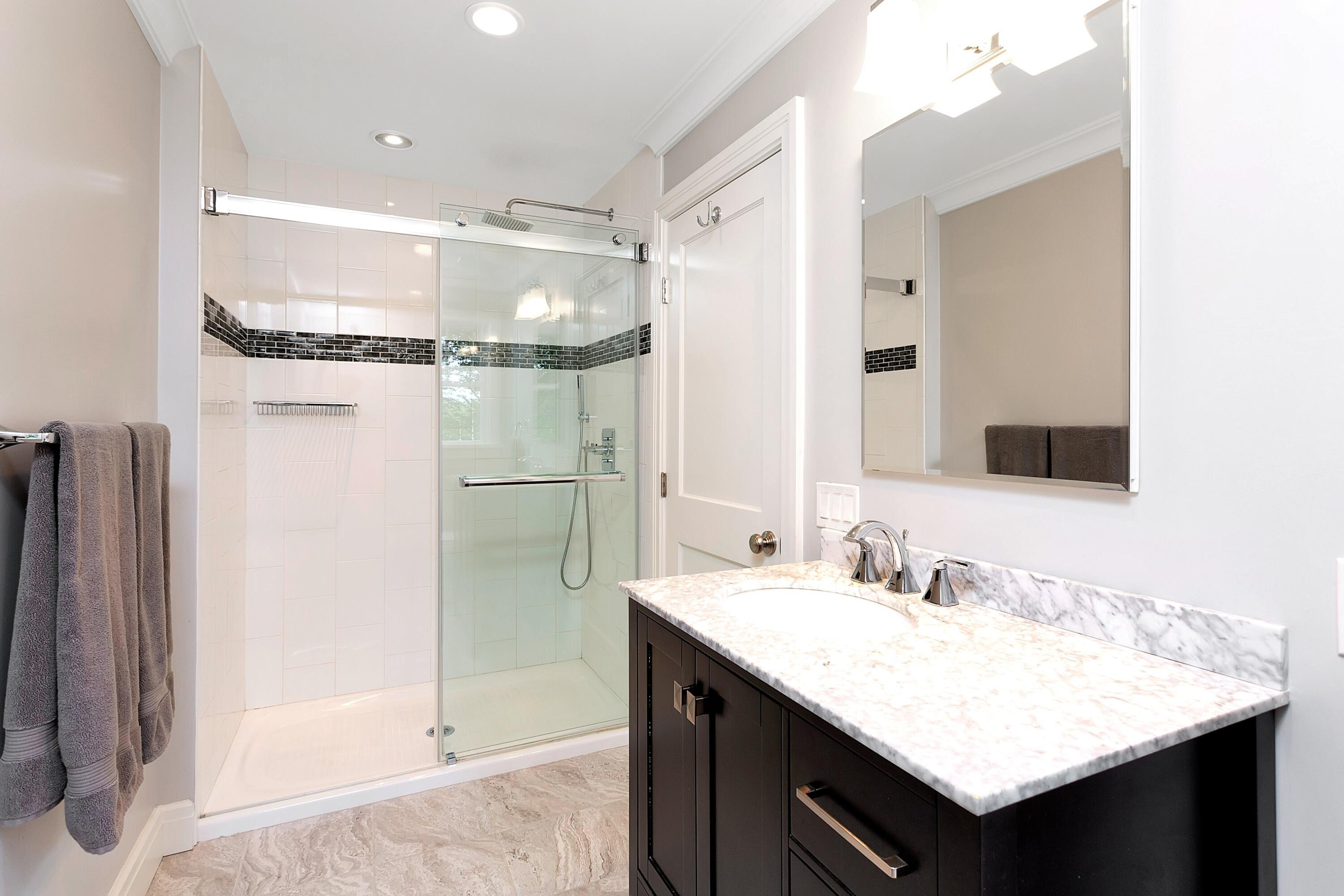 2 Cedar Gate Road Darien, CT 06820 - Photo 29 of 42 a bathroom with a granite countertop sink and a mirror