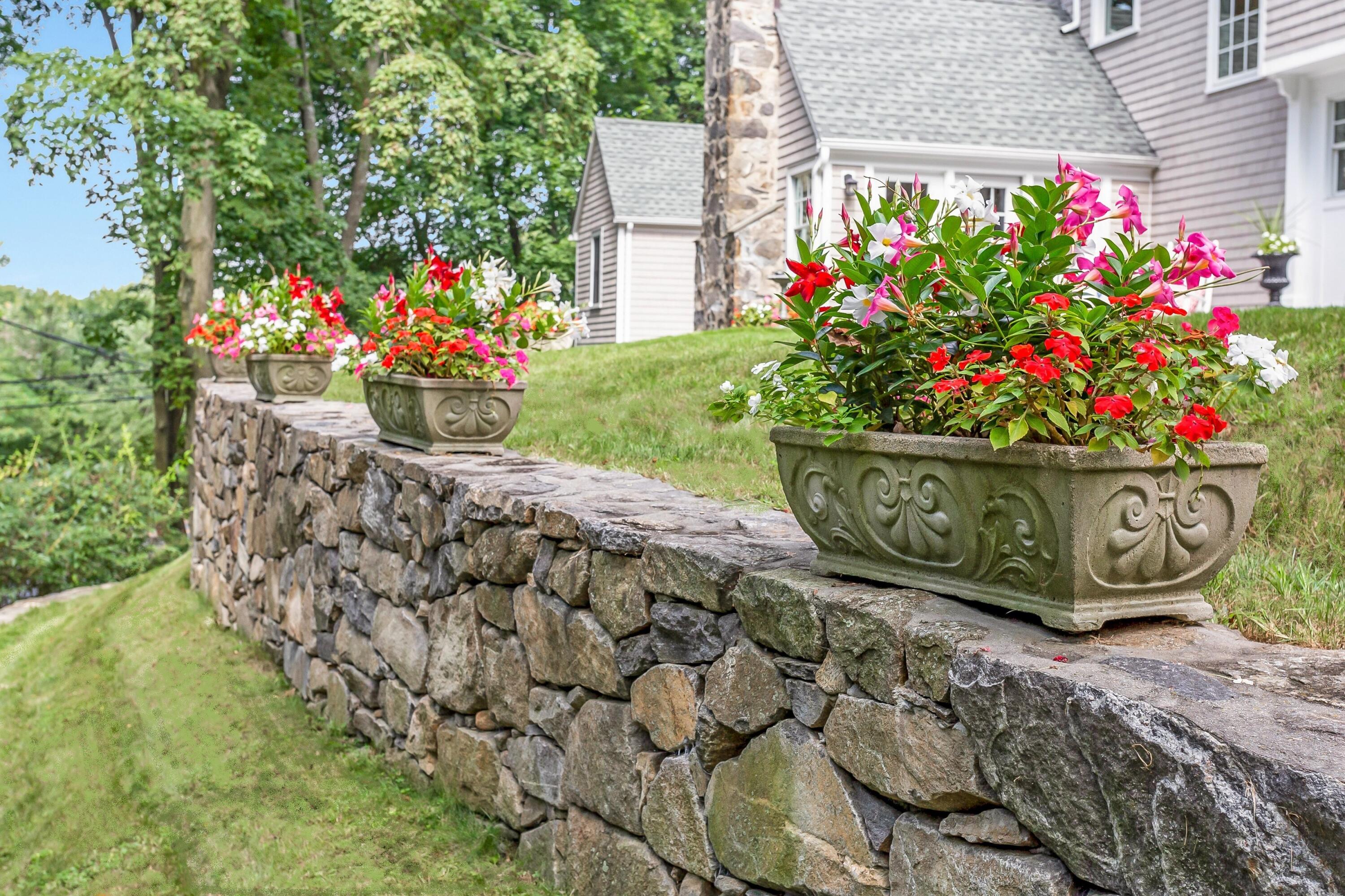 2 Cedar Gate Road Darien, CT 06820 - Photo 37 of 42 a wooden fence with some flowers
