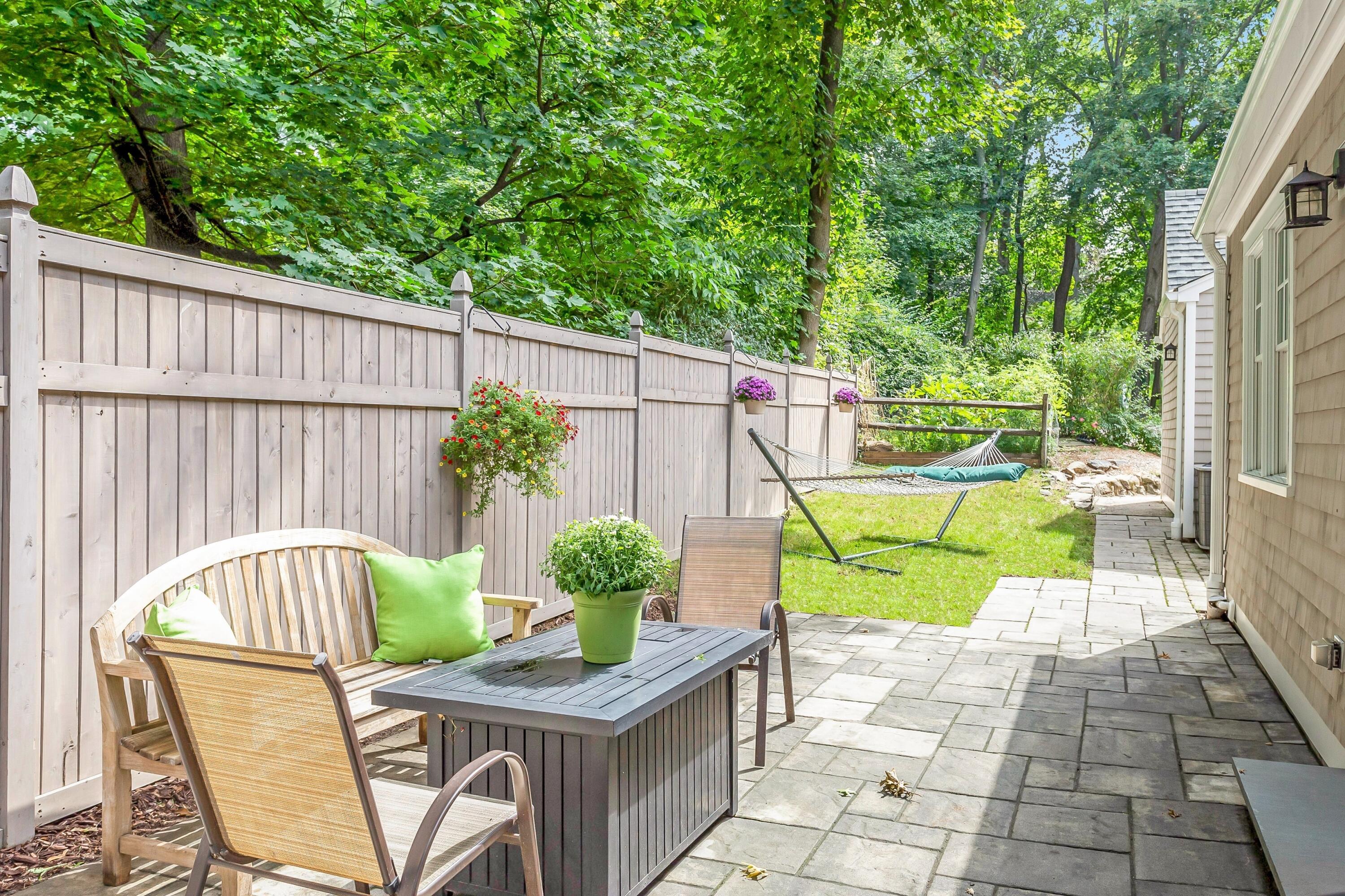 2 Cedar Gate Road Darien, CT 06820 - Photo 38 of 42 a view of a chair and table in the patio