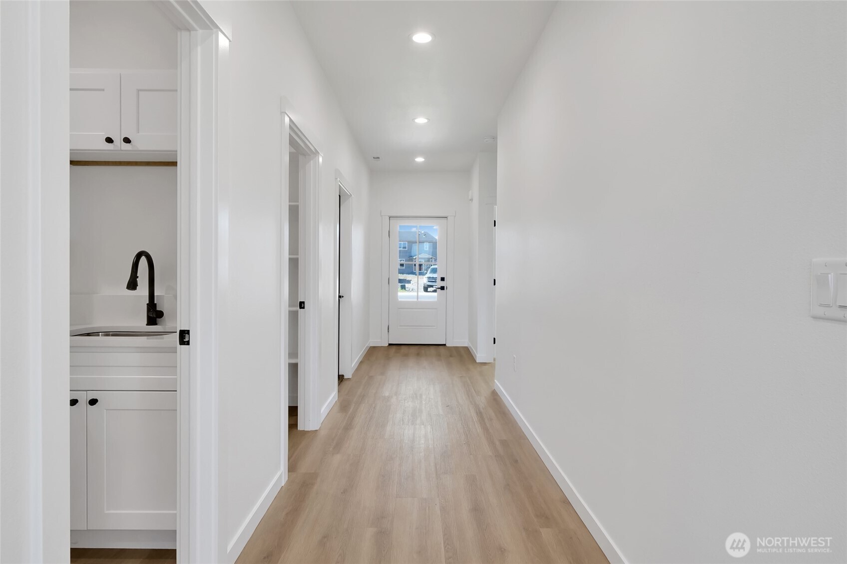 11 Parkside Loop Southeast Ephrata, WA 98823 - Photo 11 of 40 a view of a hallway with a wooden floor
