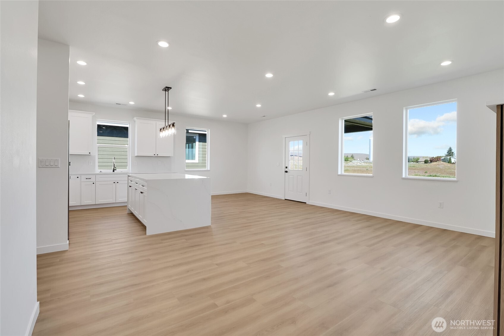 11 Parkside Loop Southeast Ephrata, WA 98823 - Photo 23 of 40 an empty room with wooden floor and windows