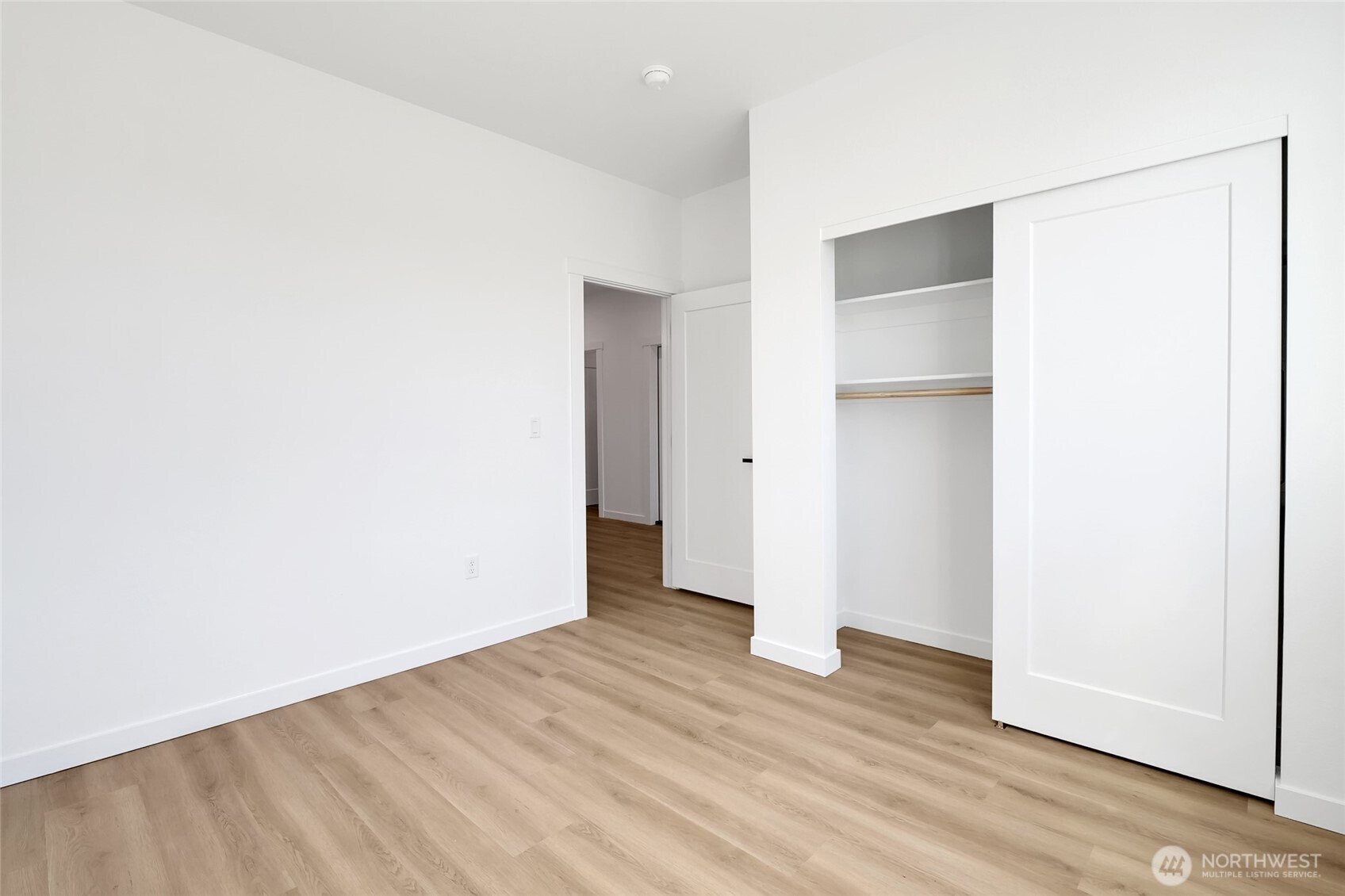 11 Parkside Loop Southeast Ephrata, WA 98823 - Photo 32 of 40 a view of an empty room with wooden floor