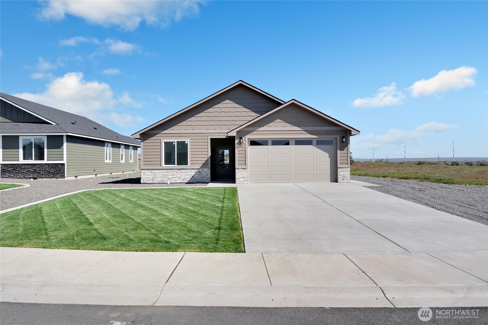 11 Parkside Loop Southeast Ephrata, WA 98823 - Photo 5 of 40 a view of a house with a yard and large tree