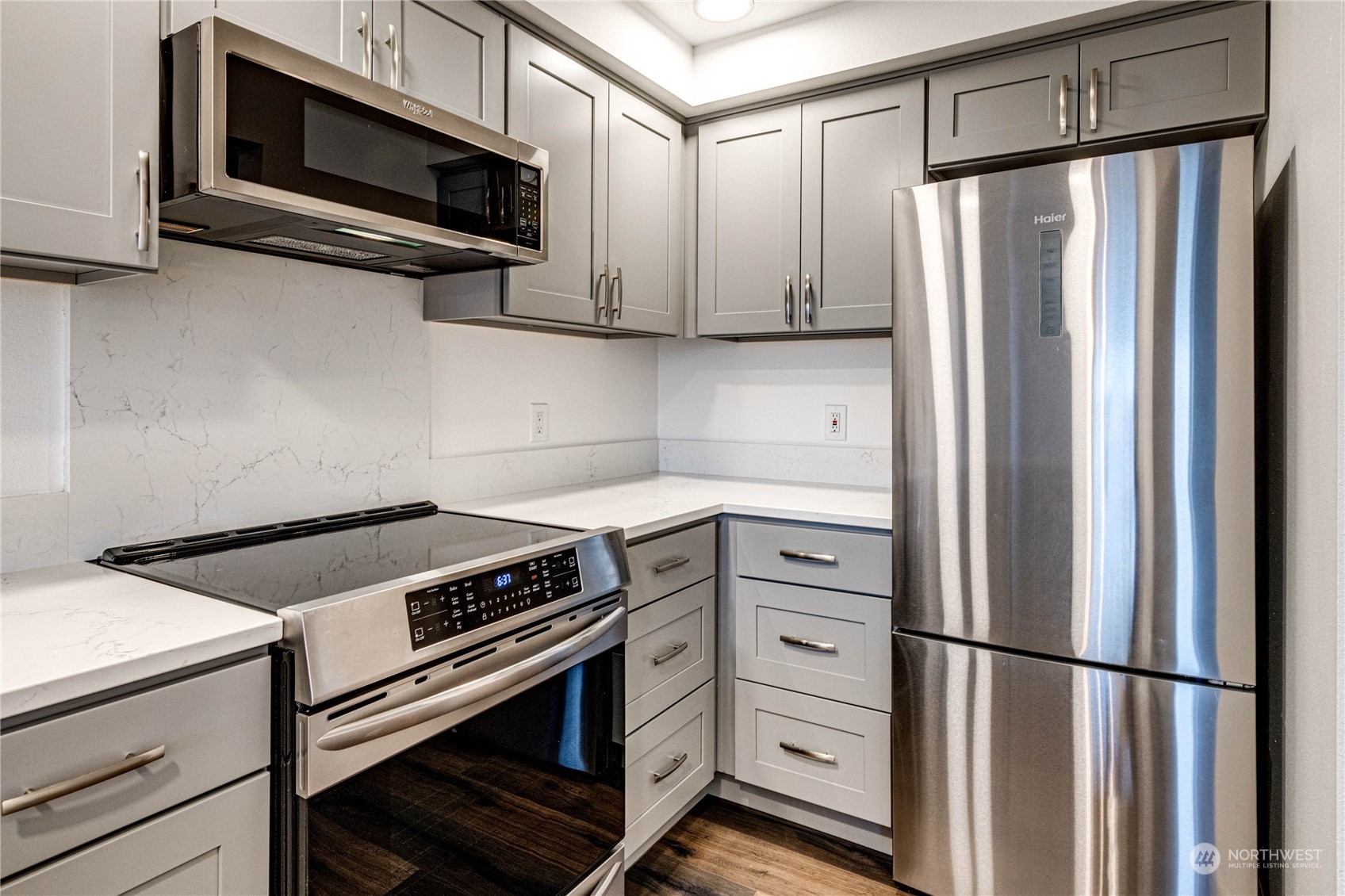 2219 Rucker Avenue, Unit 202 Everett, WA 98201 - Photo 12 of 28 a kitchen with stainless steel appliances and cabinets