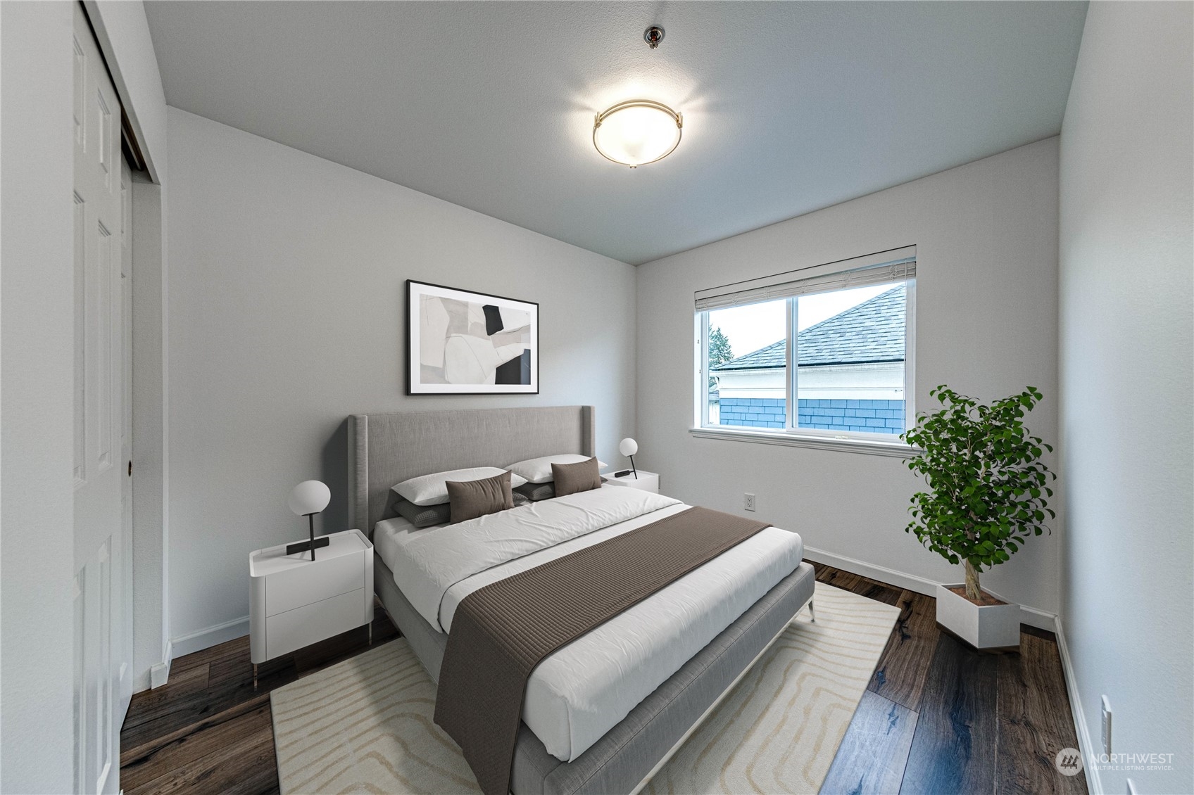 2219 Rucker Avenue, Unit 202 Everett, WA 98201 - Photo 18 of 28 a bedroom with a bed and a potted plant