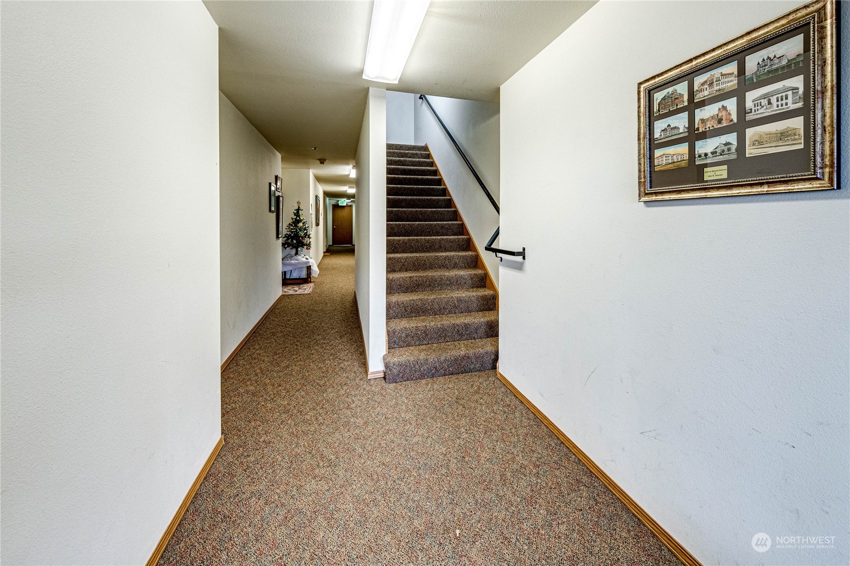 2219 Rucker Avenue, Unit 202 Everett, WA 98201 - Photo 23 of 28 a view of a hallway with stairs