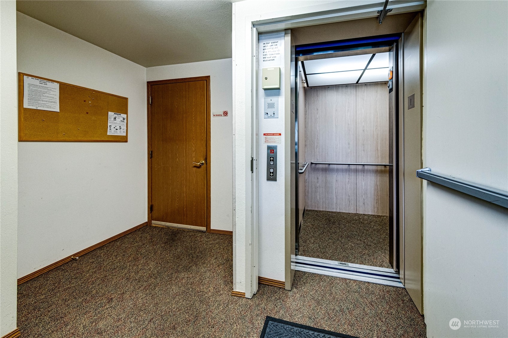 2219 Rucker Avenue, Unit 202 Everett, WA 98201 - Photo 24 of 28 a view of elevator with hallway