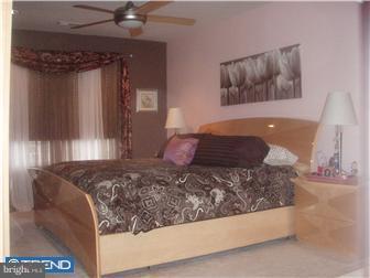 83 Colts Gait Road Marlton, NJ 08053 - Photo 7 of 7 a bedroom with a bed and a painting on the wall