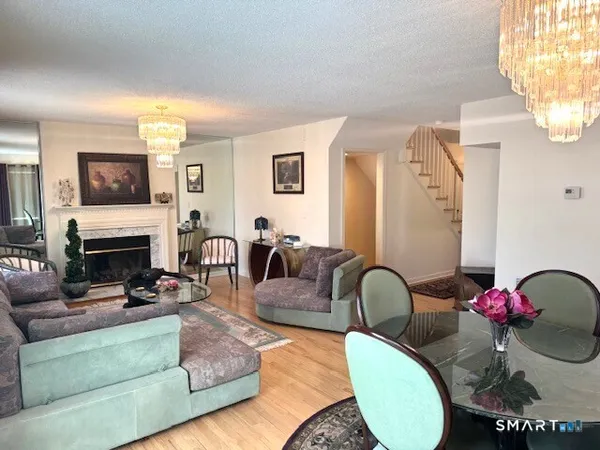 a view of livingroom with furniture and workspace