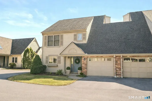 a kitchen with stainless steel appliances granite countertop a stove top oven a sink dishwasher a refrigerator and a microwave