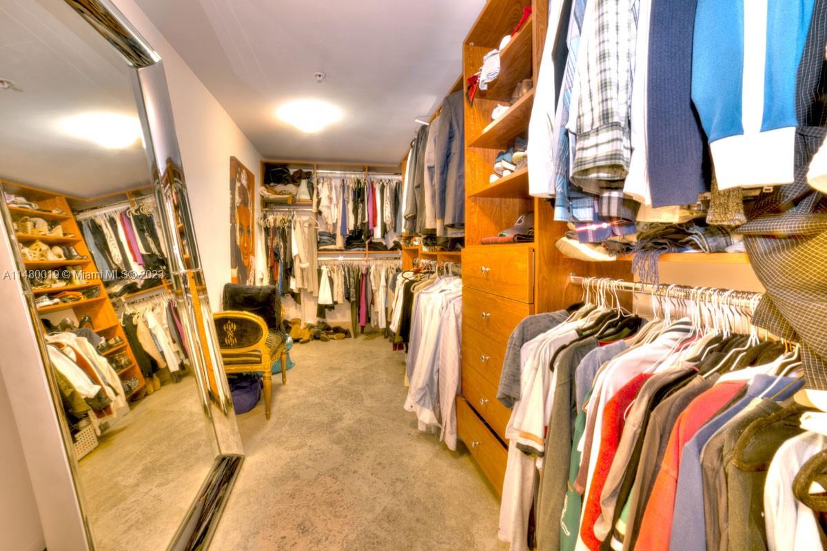 3540 Main Highway, Unit 301 Miami, FL 33133 - Photo 13 of 29 a view of walk in closet with clothes