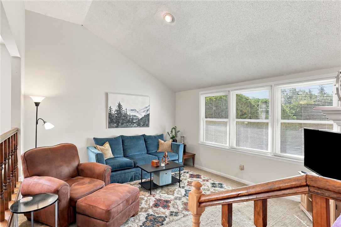 7 Woodbridge Circle Anderson, SC 29621 - Photo 5 of 26 Vaulted ceilings and generous windows create an airy atmosphere in this comfortable living area.