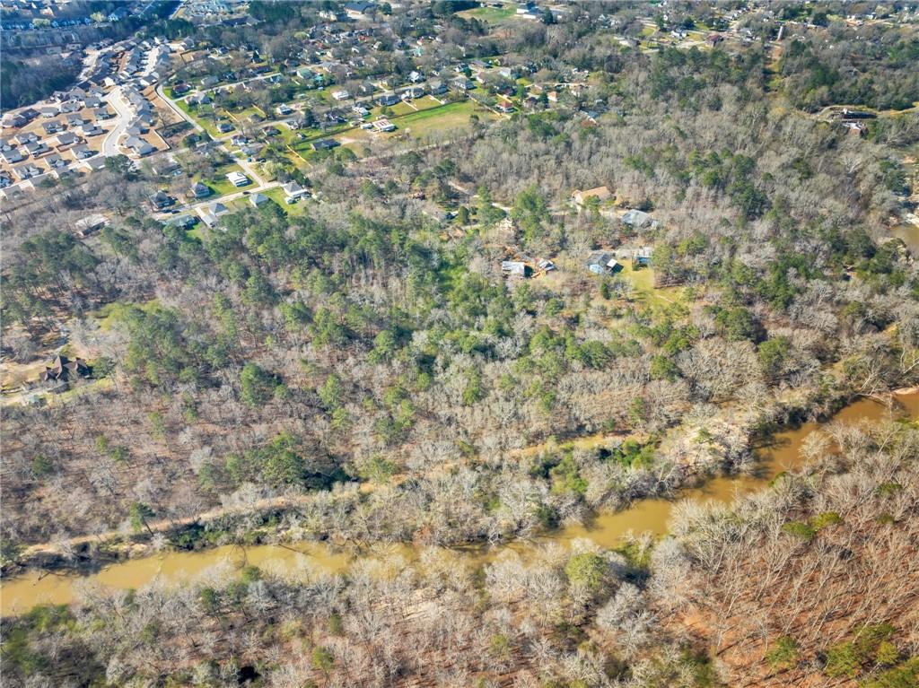 1822 New Street Northeast Conyers, GA 30012 - Photo 6 of 11 a view of a yard with a tree