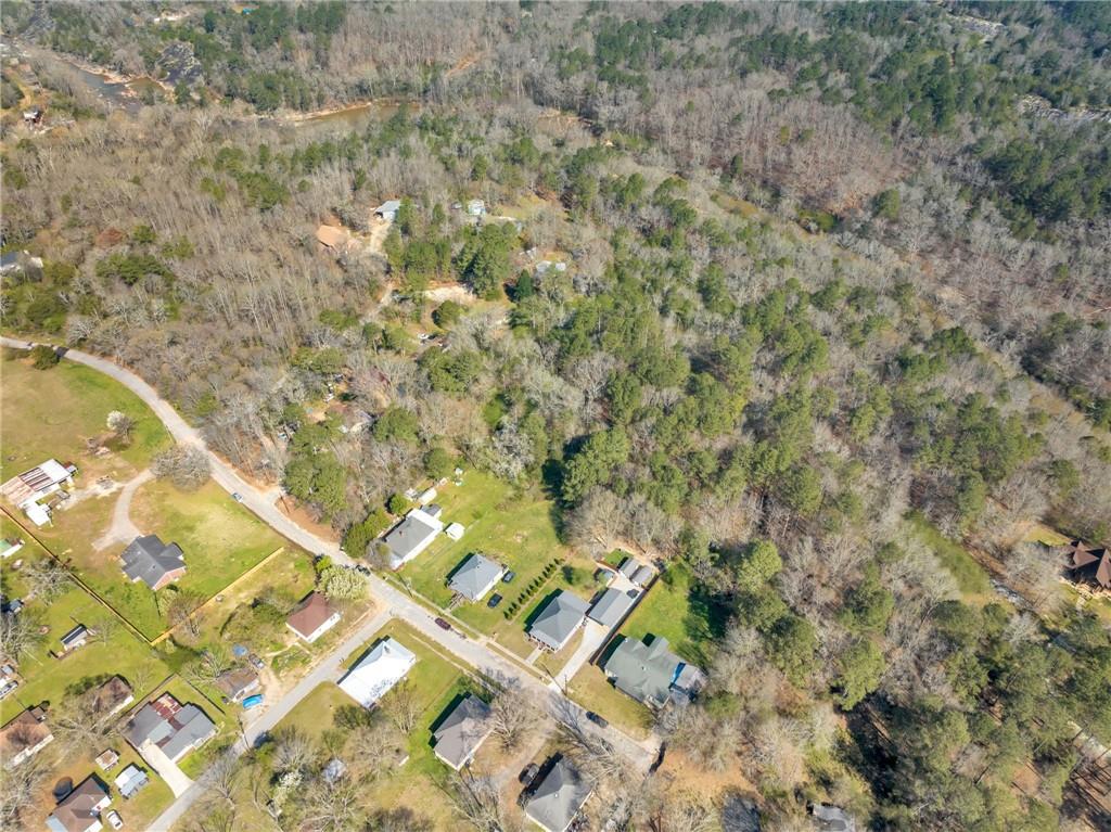 1822 New Street Northeast Conyers, GA 30012 - Photo 9 of 11 a view of a yard with large trees