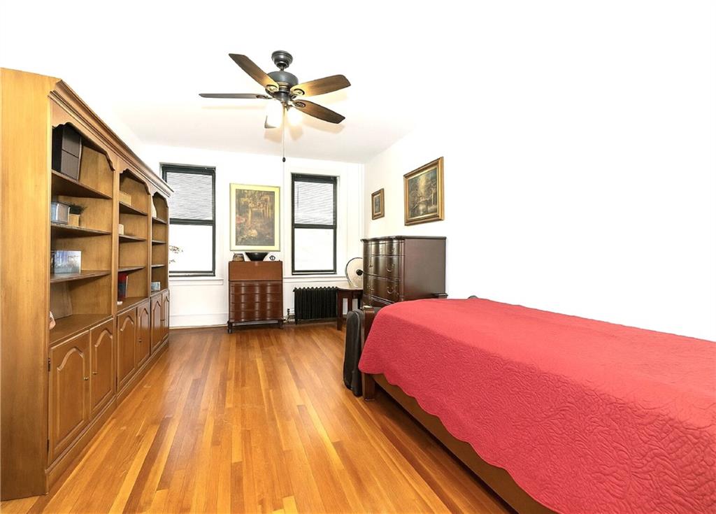 255 79th Street, Unit B4 Brooklyn, NY 11209 - Photo 11 of 23 a bed room with a bed and dresser