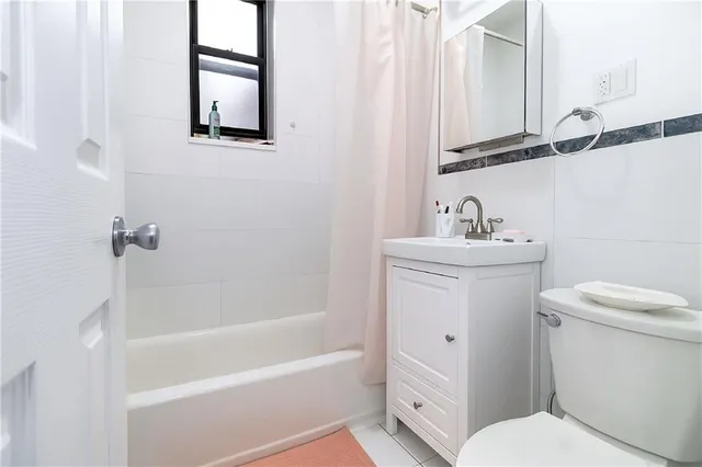 a bathroom with a sink toilet and bathtub