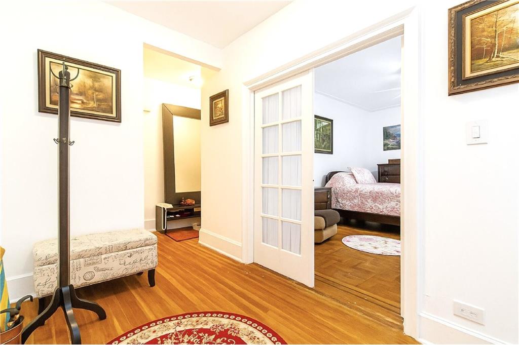 255 79th Street, Unit B4 Brooklyn, NY 11209 - Photo 15 of 23 a bedroom with a bed and wooden floor