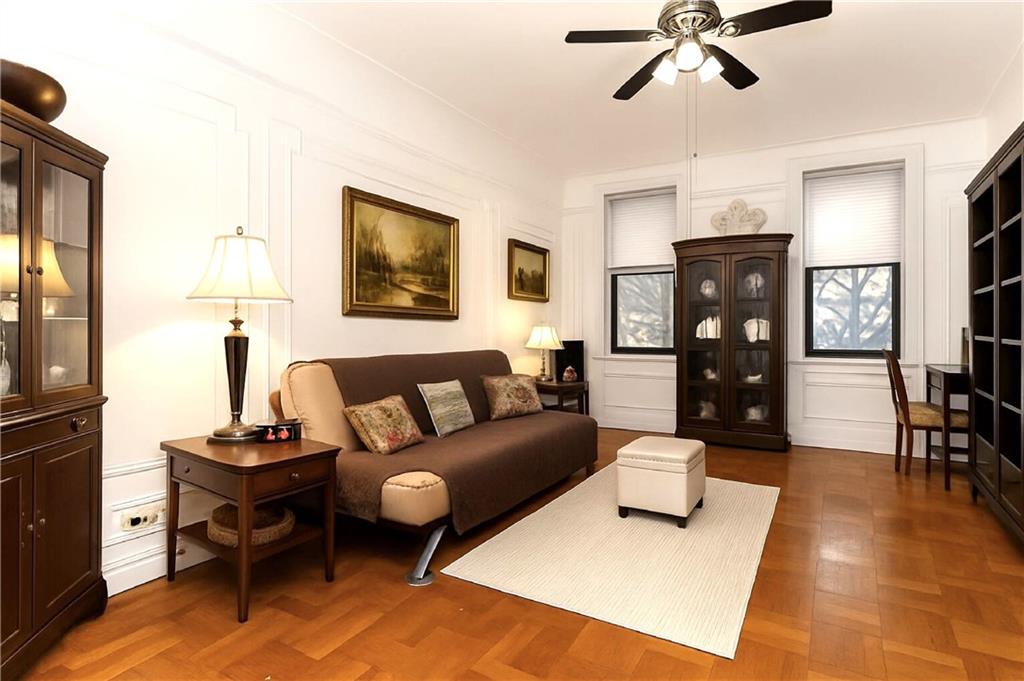 255 79th Street, Unit B4 Brooklyn, NY 11209 - Photo 16 of 23 a living room with furniture and a flat screen tv