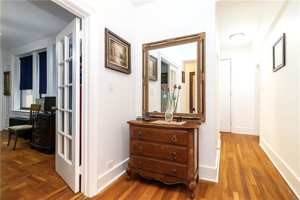 255 79th Street, Unit B4 Brooklyn, NY 11209 - Photo 5 of 23 a view of room with wall frames and a mirror