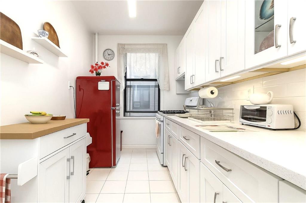 255 79th Street, Unit B4 Brooklyn, NY 11209 - Photo 6 of 23 a kitchen with granite countertop a sink stove and cabinets