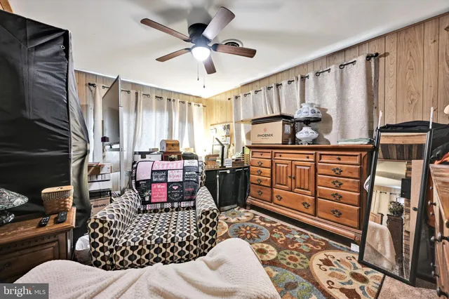 a bedroom with furniture window and lamp