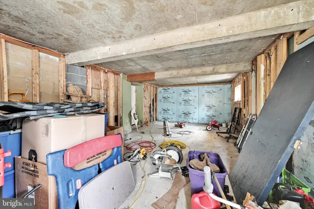 a room with gym equipment and large mirror