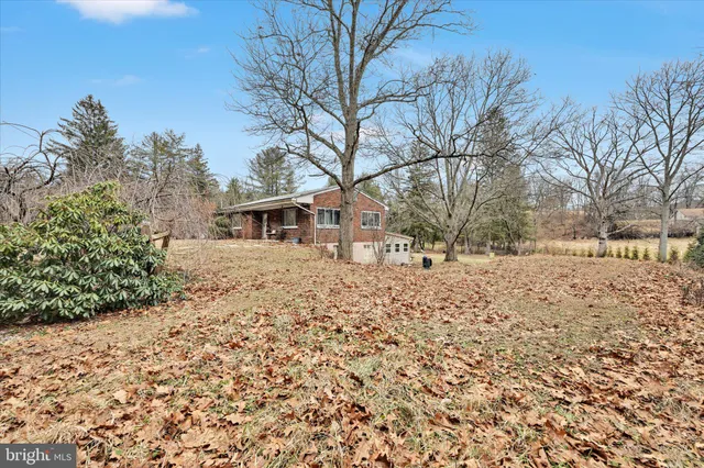 a view of a brick house with a small window and front door