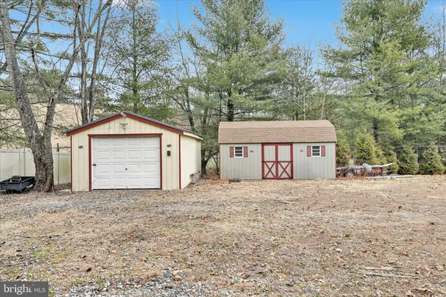 a car parked in front of house with a yard