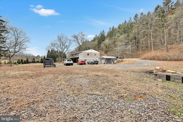 a view of house with a yard