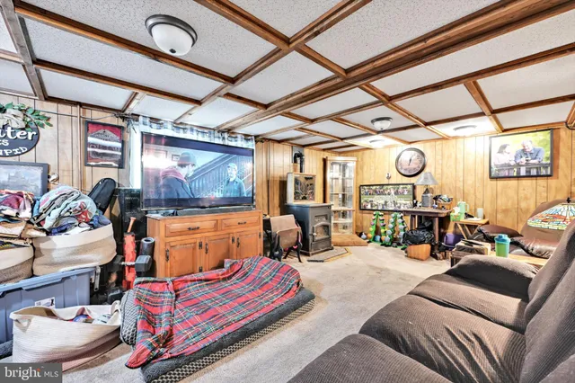 a outdoor living space with furniture and a ceiling fan