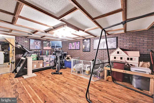 a view of a hall with wooden floor